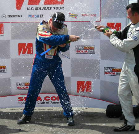 Mason enjoys the champagne reception in Victory Lane!