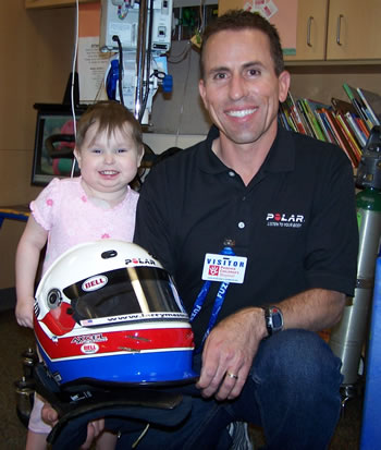 Larry Mason visiting with Trissa, a patient at PCH, in one of the play rooms. 